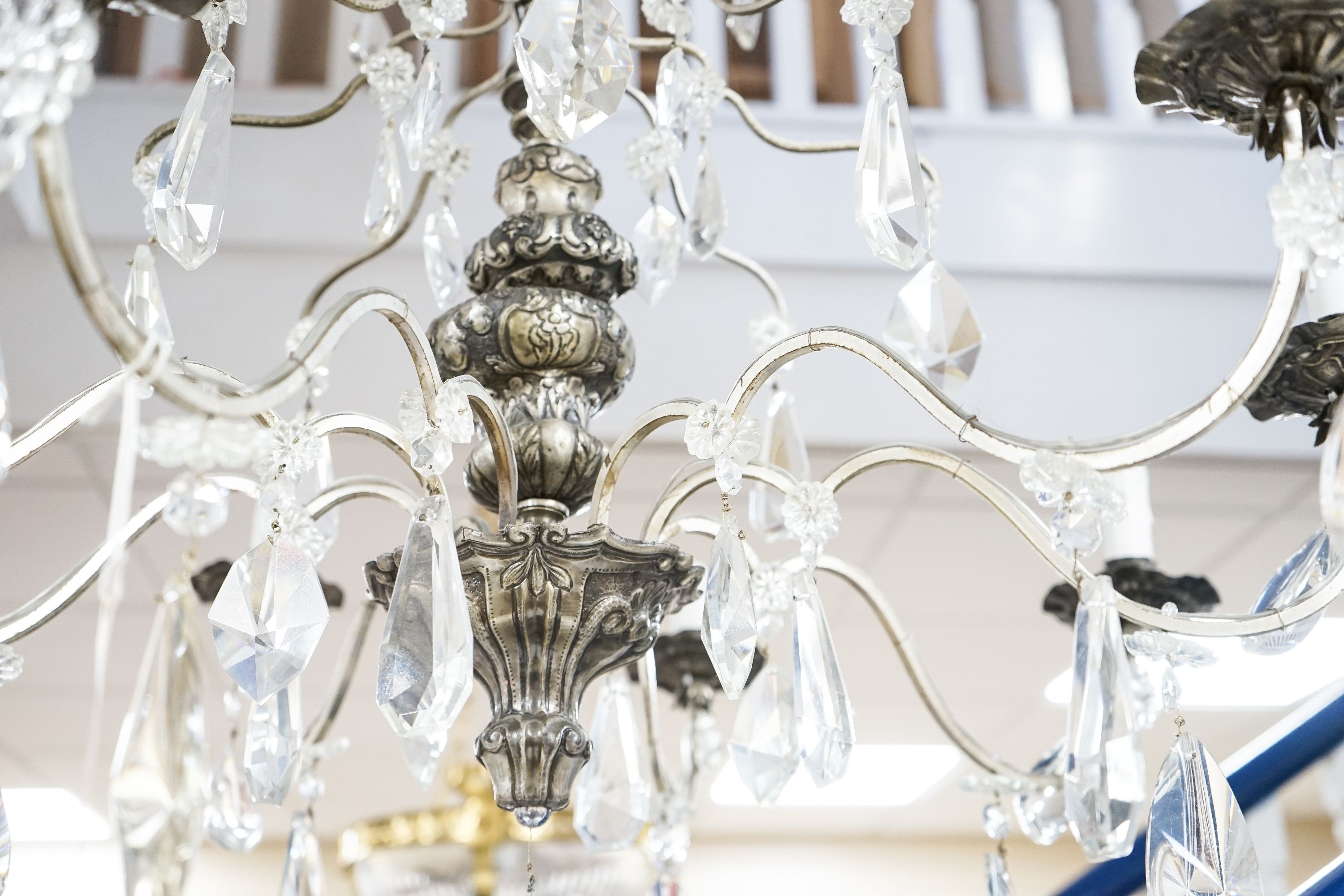 A silvered and crystal eight branch chandelier, approx. height 79cm